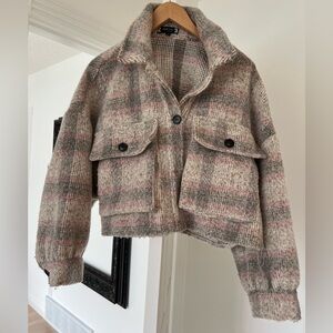 Bomber Style Flannel coat in a plaid pattern fabric. Perfect for fall weather.